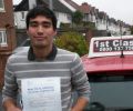 Cameron with Driving test pass certificate